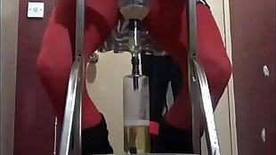 crossdressing sissy pissing in a bottle from on a ladder drinks the lot